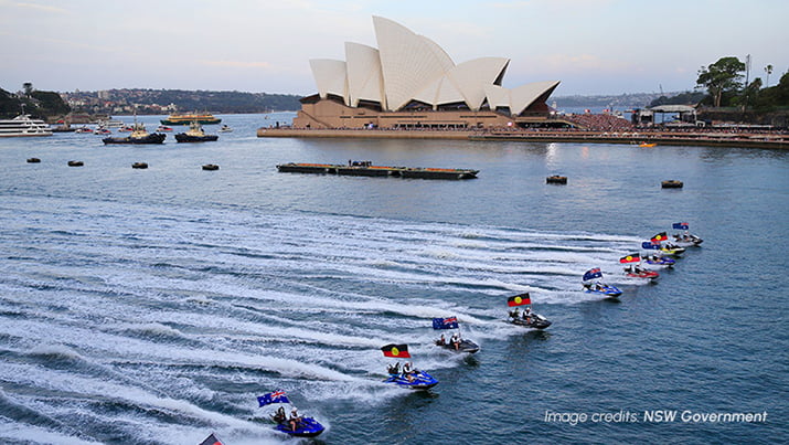 The Opera House sails lit up with vibrant colours on Australia Day.